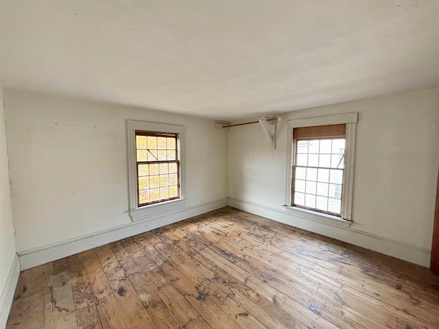 unfurnished room featuring light hardwood / wood-style flooring