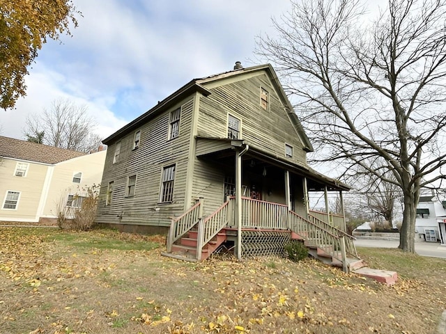 back of house with a porch