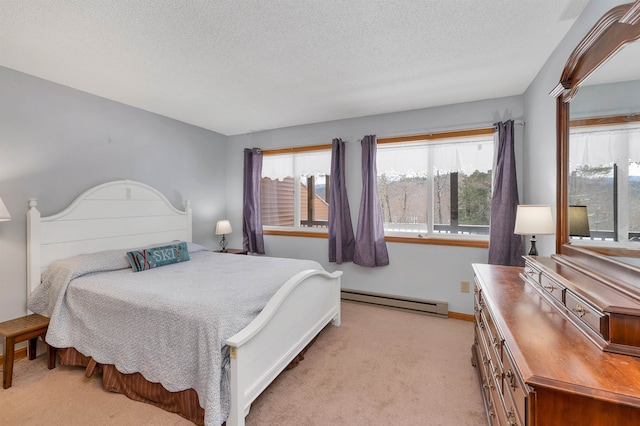 carpeted bedroom featuring a textured ceiling and a baseboard radiator