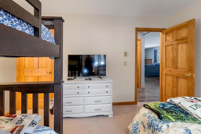 bedroom featuring light carpet