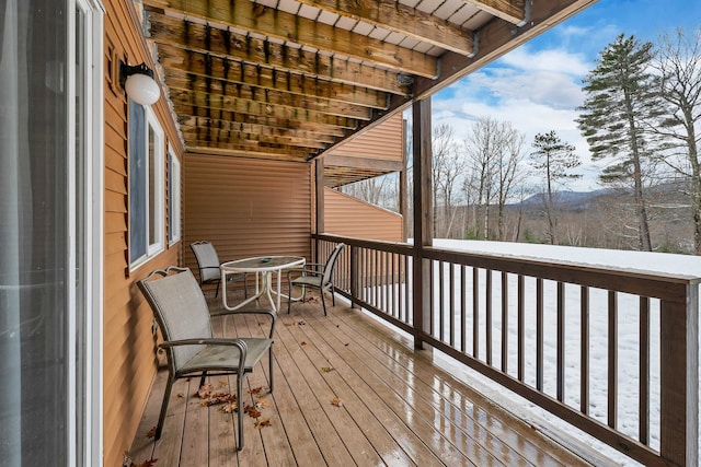 view of snow covered deck