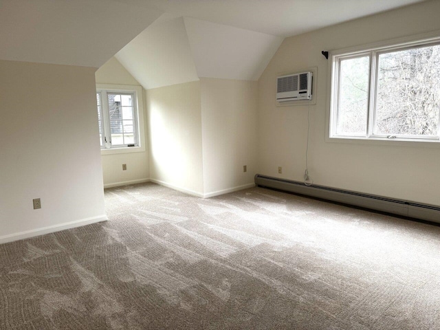 bonus room featuring lofted ceiling, light colored carpet, a wall mounted AC, and baseboard heating