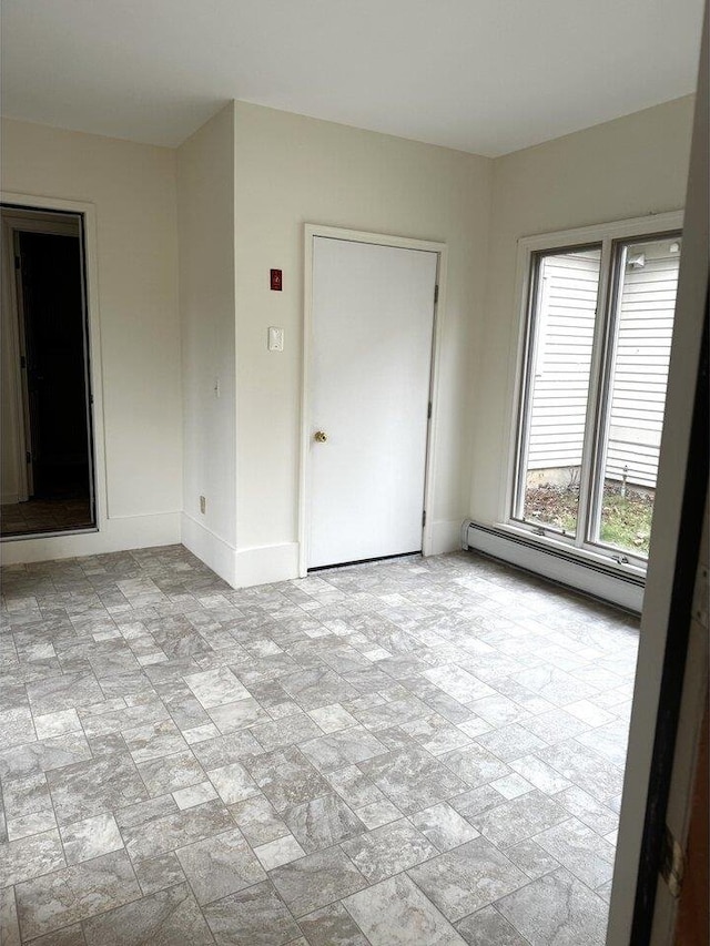 spare room with a baseboard radiator