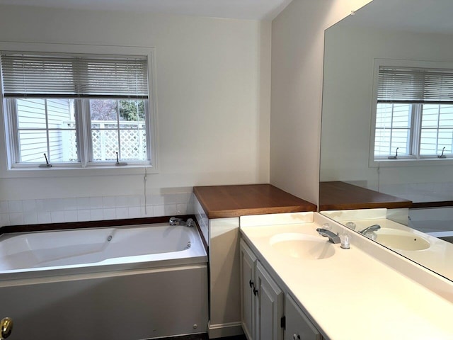 bathroom featuring vanity and a bathtub