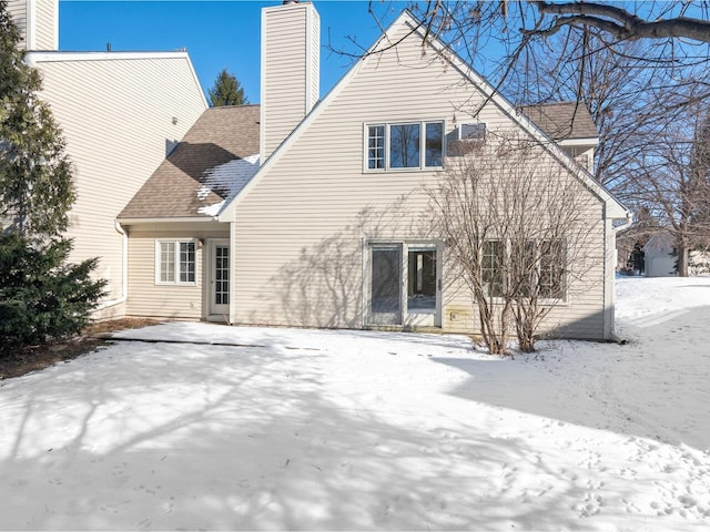 view of snow covered house