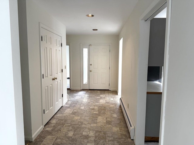 foyer featuring a baseboard radiator