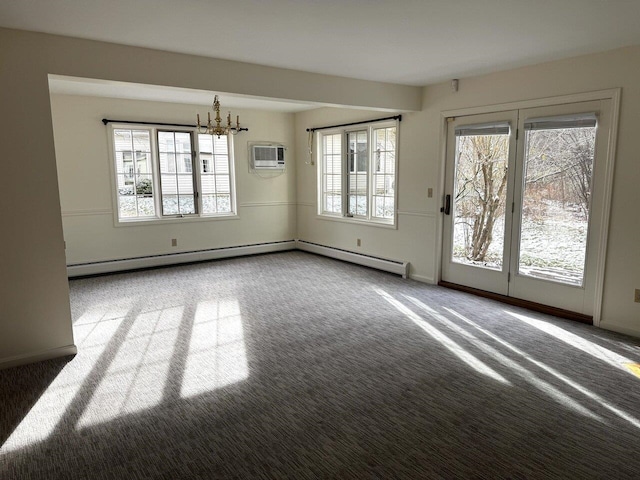 interior space with a wall mounted air conditioner, a chandelier, and a baseboard heating unit