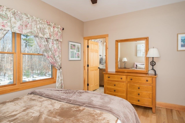 bedroom with ceiling fan and light hardwood / wood-style flooring