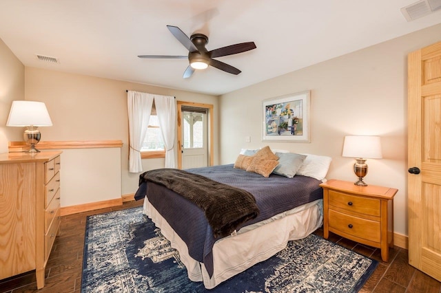 bedroom with ceiling fan and dark hardwood / wood-style flooring