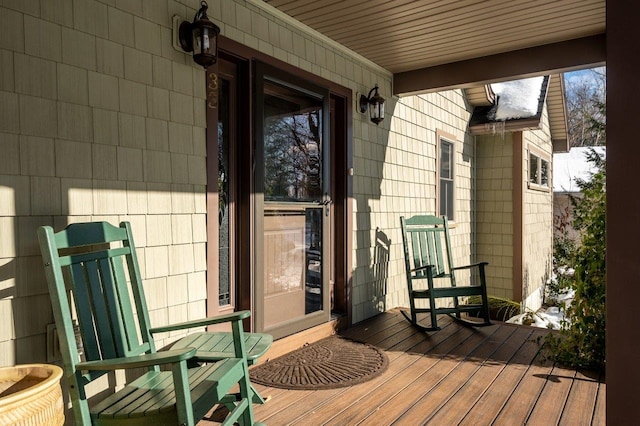 wooden terrace with a porch