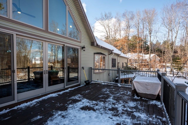 view of snow covered deck