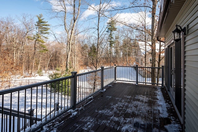 view of snow covered deck