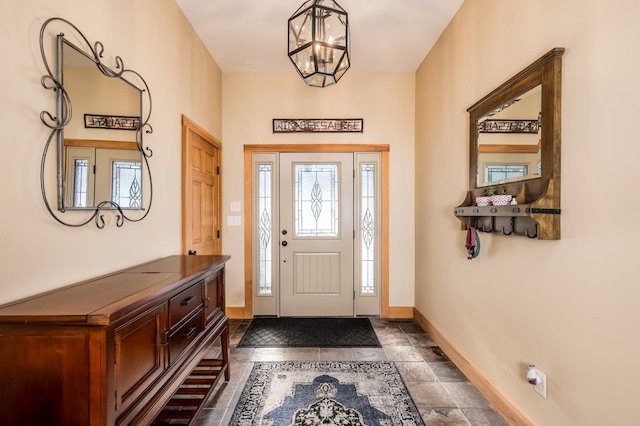 entrance foyer featuring a notable chandelier