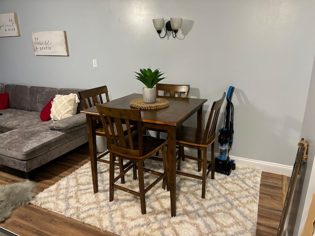 dining area with wood-type flooring