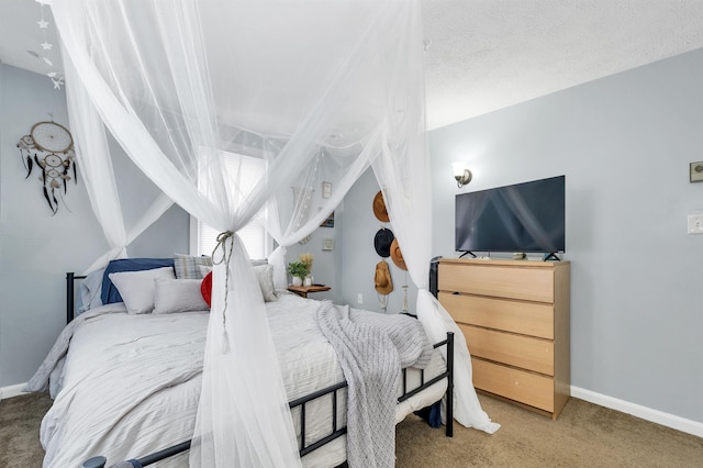 carpeted bedroom featuring a textured ceiling