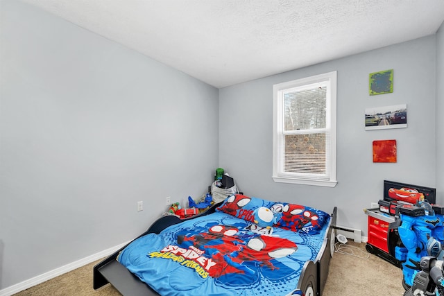 carpeted bedroom with baseboard heating and a textured ceiling