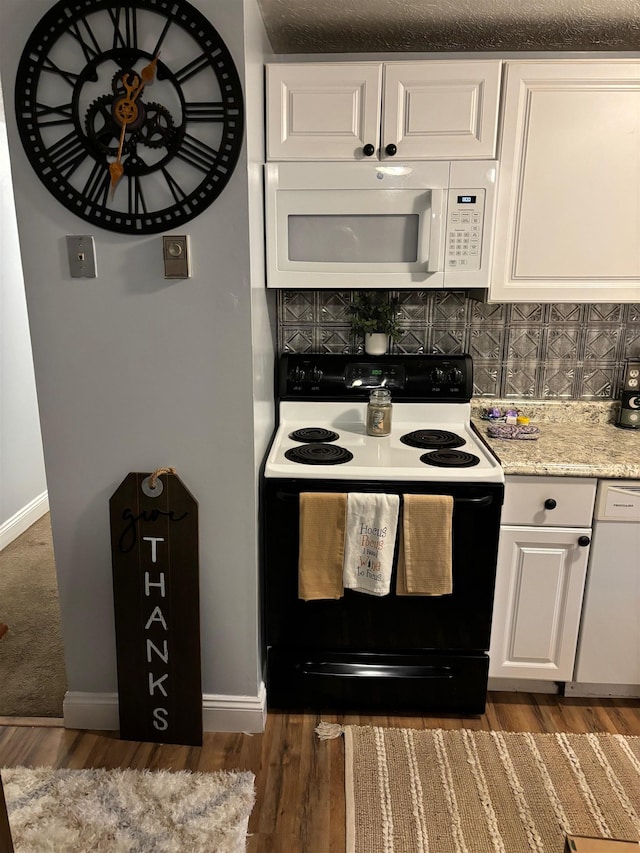 kitchen with white cabinets, backsplash, dark hardwood / wood-style flooring, and white appliances