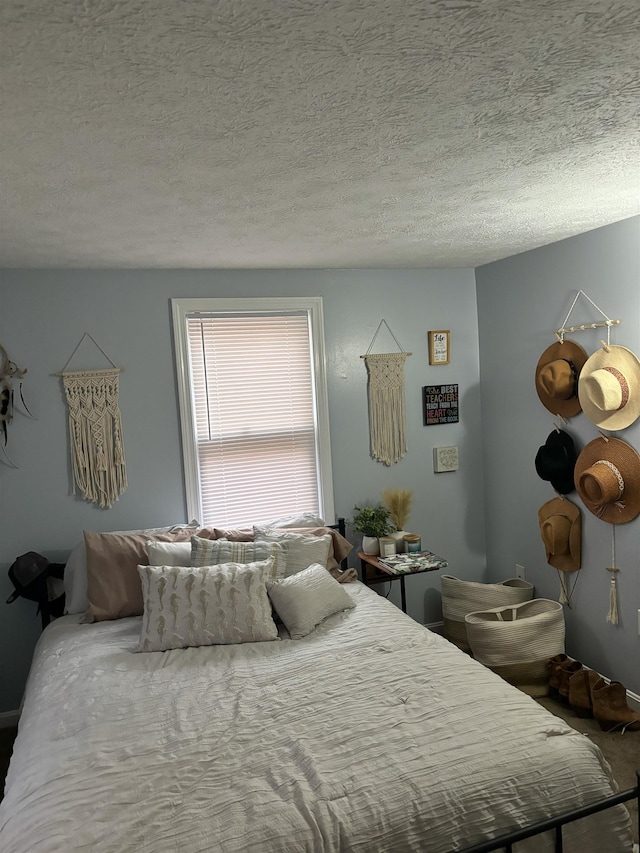 bedroom featuring a textured ceiling