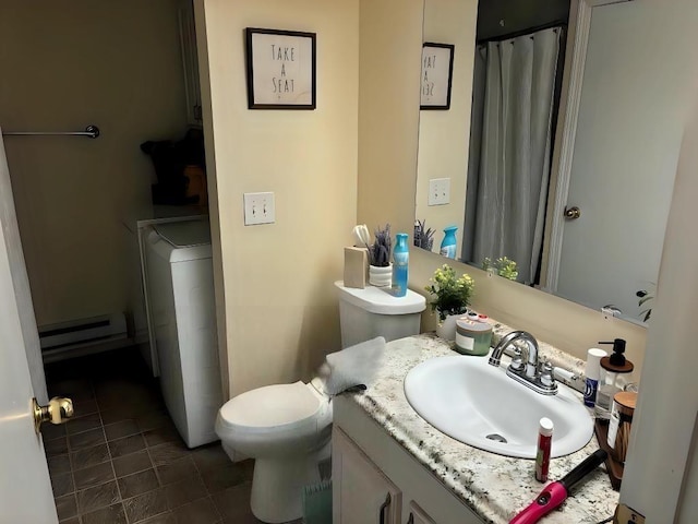 bathroom with toilet, vanity, and a baseboard radiator