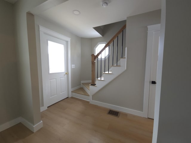 entrance foyer featuring a healthy amount of sunlight and light hardwood / wood-style floors