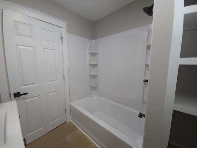 bathroom featuring shower / tub combination and wood-type flooring