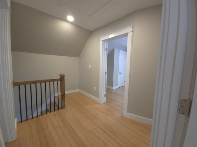 bonus room featuring light hardwood / wood-style floors and lofted ceiling