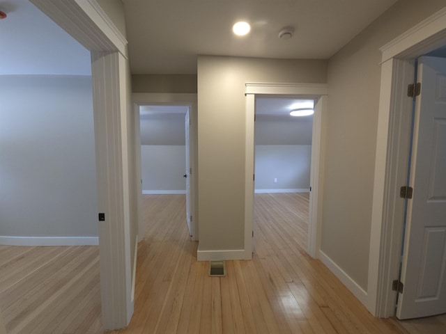 hallway featuring light wood-type flooring