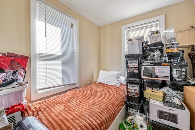 bedroom featuring multiple windows