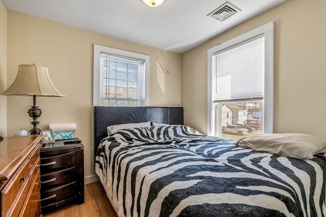 bedroom with light wood-type flooring