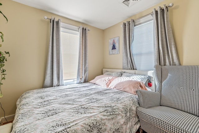 bedroom featuring multiple windows