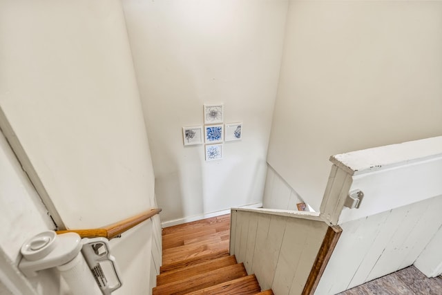 stairway featuring hardwood / wood-style flooring