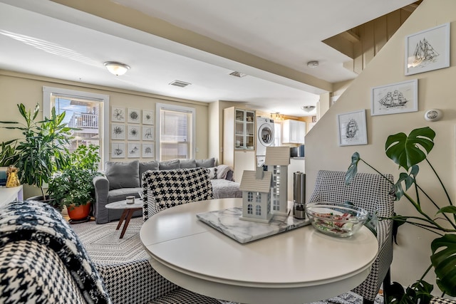 dining area featuring stacked washer and dryer