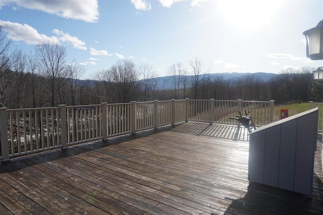 wooden deck featuring a mountain view