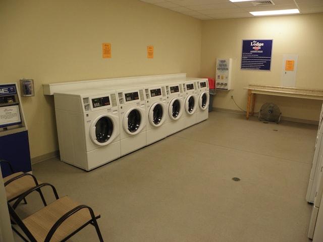 washroom featuring washing machine and dryer