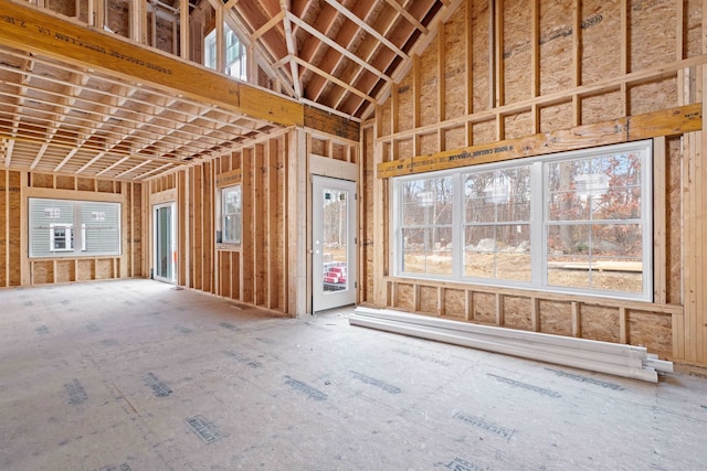 miscellaneous room featuring high vaulted ceiling