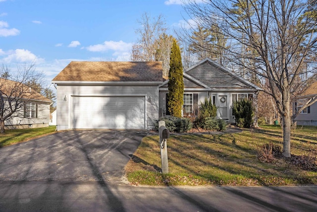 ranch-style house with a front yard and a garage