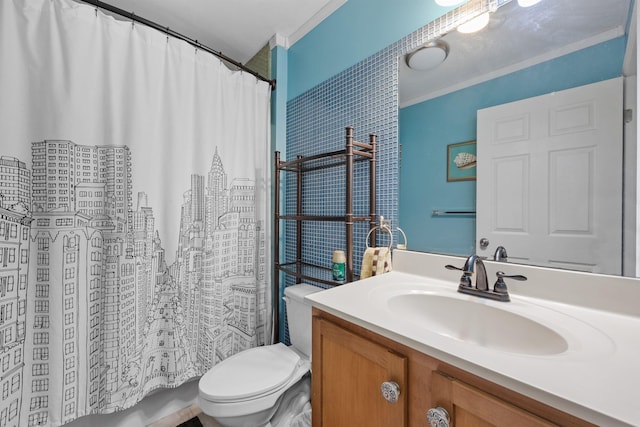 bathroom featuring toilet, vanity, and ornamental molding