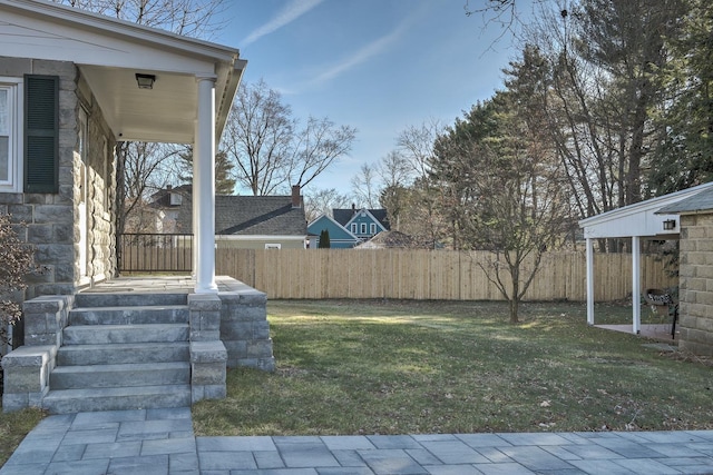 view of yard with covered porch