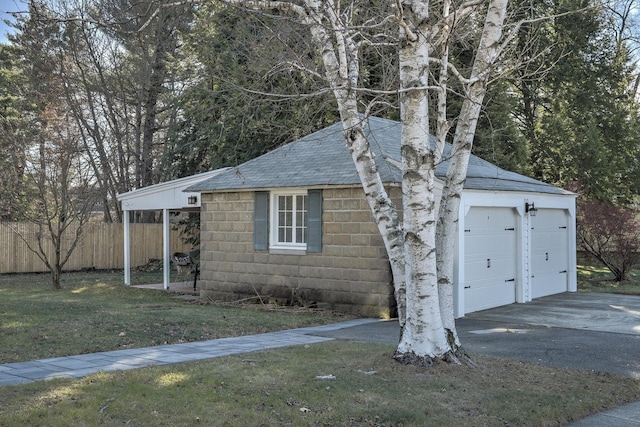 exterior space with a front yard and a garage