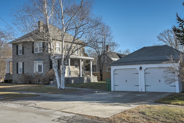 view of front of home with covered porch and a garage