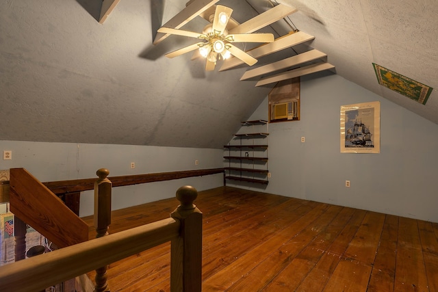 additional living space featuring lofted ceiling, wood-type flooring, and ceiling fan