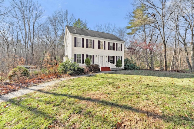 colonial-style house with a front lawn