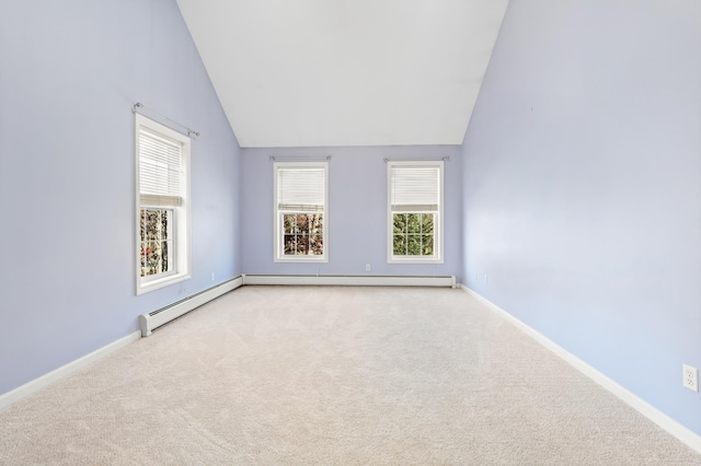 empty room with light carpet and high vaulted ceiling