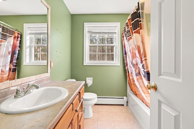 full bathroom with baseboard heating, tile patterned flooring, vanity, and a healthy amount of sunlight