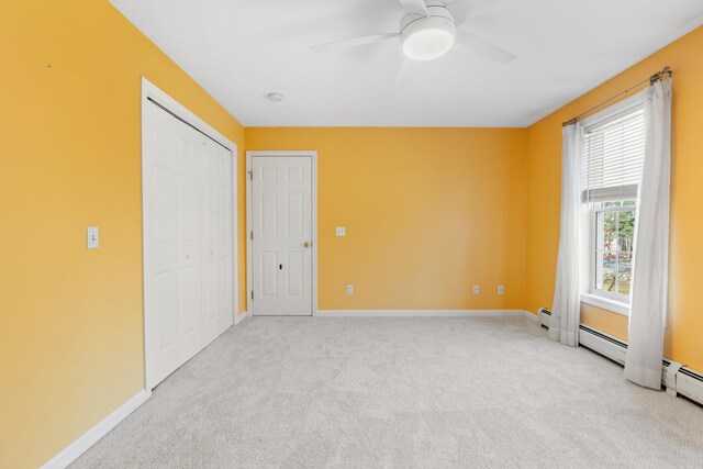 unfurnished bedroom with ceiling fan and light carpet