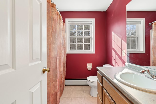 bathroom with tile patterned flooring, vanity, toilet, and baseboard heating