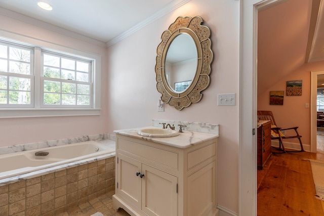 bathroom with hardwood / wood-style floors, vanity, tiled bath, and crown molding