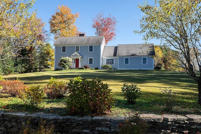 colonial home with a front yard