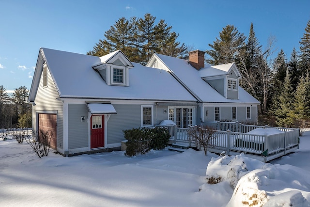 cape cod-style house with a garage