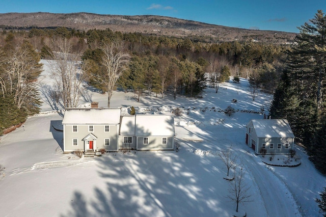 snowy aerial view featuring a mountain view